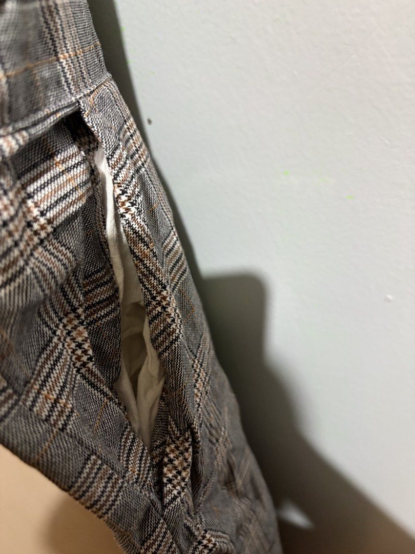 H&M Divided Grey Plaid Pinafore Jumpsuit (Category: Jumpsuits) located in Manila. Submitted by margascloset_ (Listing ID 1467305958, Image 3). Description: H&M Divided Plaid Pinafore Jumpsuit - Color/Pattern: Grey with brown and white check - Size: S - EUR 36P / UK 8P / CN 155/68A (Petite) - Features: Adjustable button straps (straps can be adjusted by both tying a knot) and two functional side pockets - Ideal for layering over tees or turtleneck