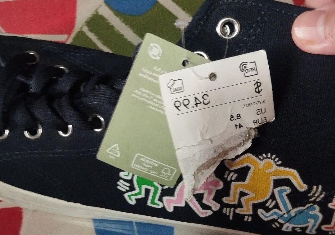 H&M Keith Haring High Top Sneakers (Category: Sneakers) located in Manila. Submitted by lene48 (Listing ID 1467212670, Image 2). Description: - Brand: H&M x Keith Haring - Style: Black high top canvas sneakers with colorful graphic prints - Details: White rubber toe cap and midsole, Keith Haring signature logo on heel tab, brown rubber outsole - Condition: Brand new with original store tag attached - Size: US 8.5 / EUR 41, size 9 men size 10 wome