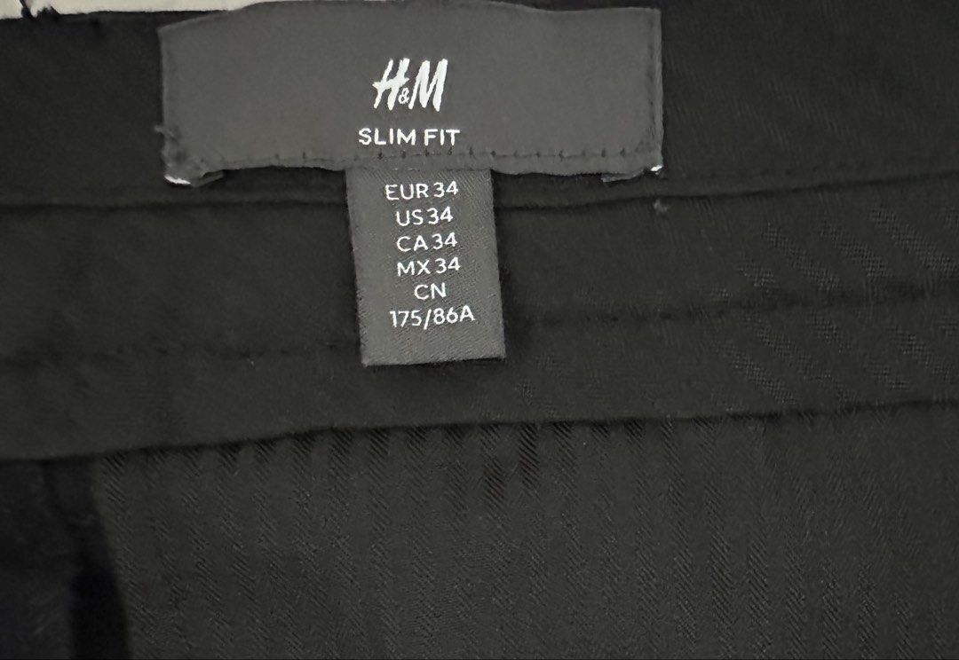 H&M Slim Fit Navy Trousers Size 34 (Category: Trousers) located in Quezon City. Submitted by aussomefinds (Listing ID 1467201815, Image 2). Description: - Brand: H&M - Item: Slim Fit Trousers - Color: Dark Navy - Size: 34 (EU/US/CA/MX) - Details: Rolled cuffs at the hem, single front button closure - Style: Clean tailoring, ideal for formal or smart-casual wear - Condition: Great for work or weekend outings.