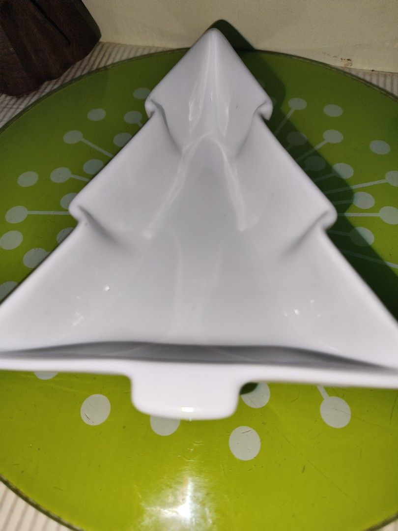 HOME White Christmas Tree Ceramic Dish Bowl (Category: Dinnerware & Cutlery) located in Manila. Submitted by reascheyss51406 (Listing ID 1467171307, Image 2). Description: - Festive Christmas tree-shaped ceramic dish - Brand: HOME (back stamp) - Microwave and dishwasher safe - Smooth glaze with no chips or cracks - Ideal for holiday snacks, dips, or small trinkets.