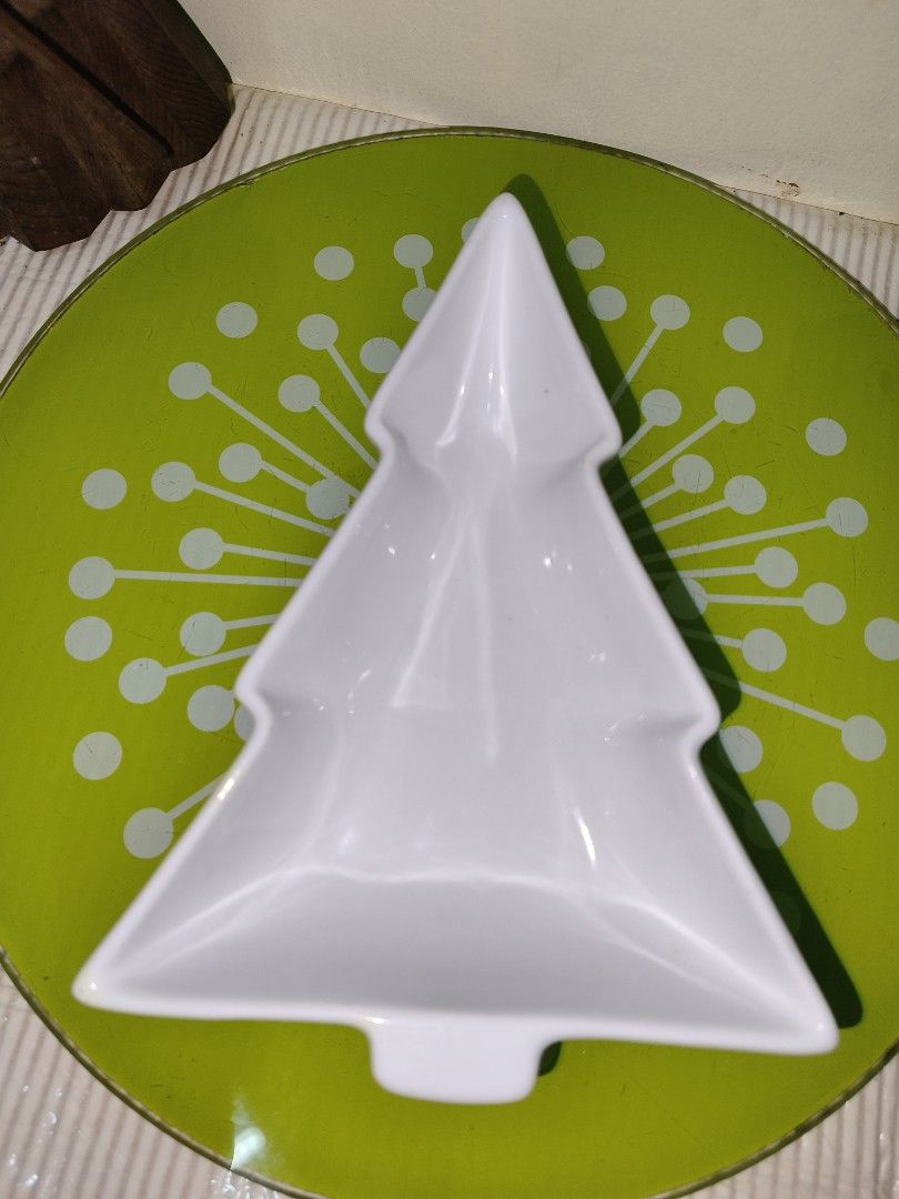 HOME White Christmas Tree Ceramic Dish Bowl (Category: Dinnerware & Cutlery) located in Manila. Submitted by reascheyss51406 (Listing ID 1467171307, Image 1). Description: - Festive Christmas tree-shaped ceramic dish - Brand: HOME (back stamp) - Microwave and dishwasher safe - Smooth glaze with no chips or cracks - Ideal for holiday snacks, dips, or small trinkets.