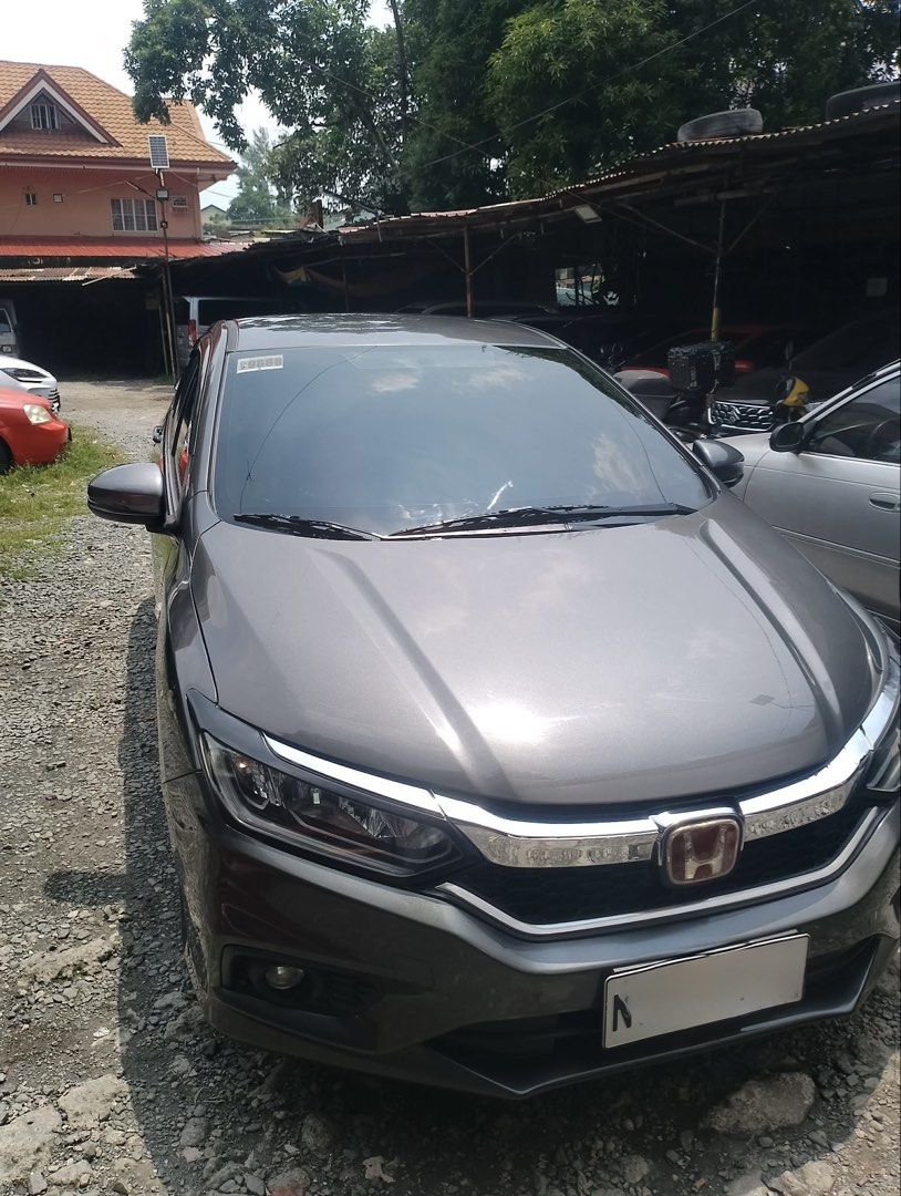 Honda City 1.5 i-VTEC Auto (Category: Used Cars) located in Manila. Submitted by annamariea81151 (Listing ID 1467173388, Image 2). Description: FOR SALE: 2018 HONDA CITY i-VTEC AUTOMATIC PRICE: ₱480,000 — SLIGHTLY NEGOTIABLE LOW MILEAGE | EXCELLENT CONDITION | WELL-KEPT UNIT 📌 CAR DETAILS: 🚗 Model: 2018 Honda City ⚙️ Engine: i-VTEC 🔄 Transmission: Automatic 📍 Mileage: ONLY 28,000 KM 🎨 Color: Dark Gray 💺 Black leather upholstery 🛞 Alloy whe