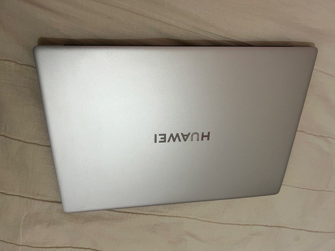 Huawei Laptop with Full Keyboard Silver (Category: Laptops & Notebooks) located in Nabunturan. Submitted by mariaheeee (Listing ID 1467251366, Image 2). Description: - Color: Sleek Silver - Processor: Intel Core for reliable daily performance - Keyboard: Full-size with a numeric keypad and integrated trackpad - Display: Clean screen bezels featuring a convenient top camera notch - Extra Feature: Huawei Share enabled - Best For: Work, school, and 