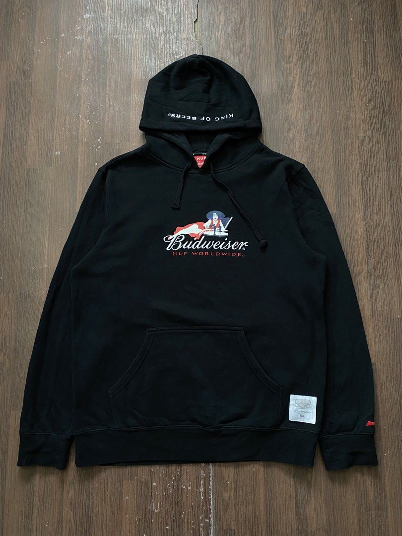 HUF x Budweiser Heritage Pullover Hoodie (Category: Coats, Jackets and Outerwear) located in Cebu City. Submitted by 0pong (Listing ID 1467200482, Image 1). Description: •Collaboration: HUF Worldwide x •Budweiser As new •No issue •Size XL tag (24x29) •Design Features: • Embroidered Budweiser “Heritage” pinup/logo graphic on the center chest with “HUF WORLDWIDE” branding below it. • Embroidered “King of Beers” slogan along the crown/edge of the dr