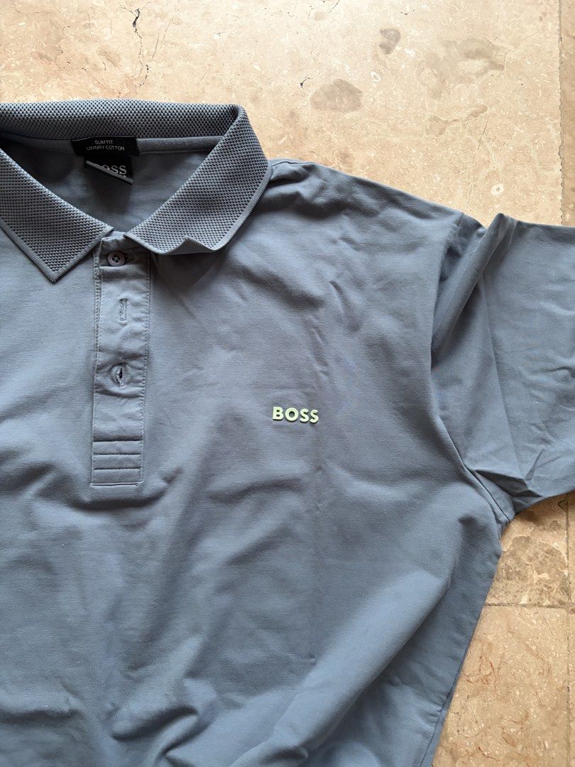 Hugo Boss Polo, Slate Blue (Category: Tshirts & Polo Shirts ) located in Quezon City. Submitted by tidyup.lara (Listing ID 1467295199, Image 3). Description: Best fits L-XL frames Shoulder 19” Bust 44” Waist 42” Length 30” Condition 8/10: used but in good condition.