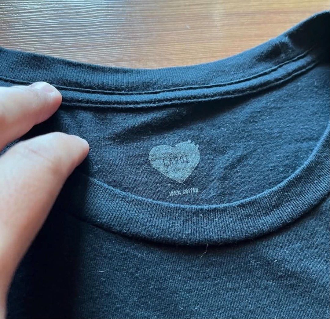 Human Made T-Shirt (Category: Tshirts & Polo Shirts ) located in Rizal. Submitted by timelessfinds89_ (Listing ID 1467319164, Image 2). Description: - Brand: Human Made - Style: Short sleeve tee / Regular crew neck fit - Color: Black - Size: Large - Material: Heavy cotton fabric - Details: Iconic heart logo printed near the bottom hem - Authenticity: Genuine interior neck tag and product tags attached (Made in China by Otsumo Co.) Condition : goo