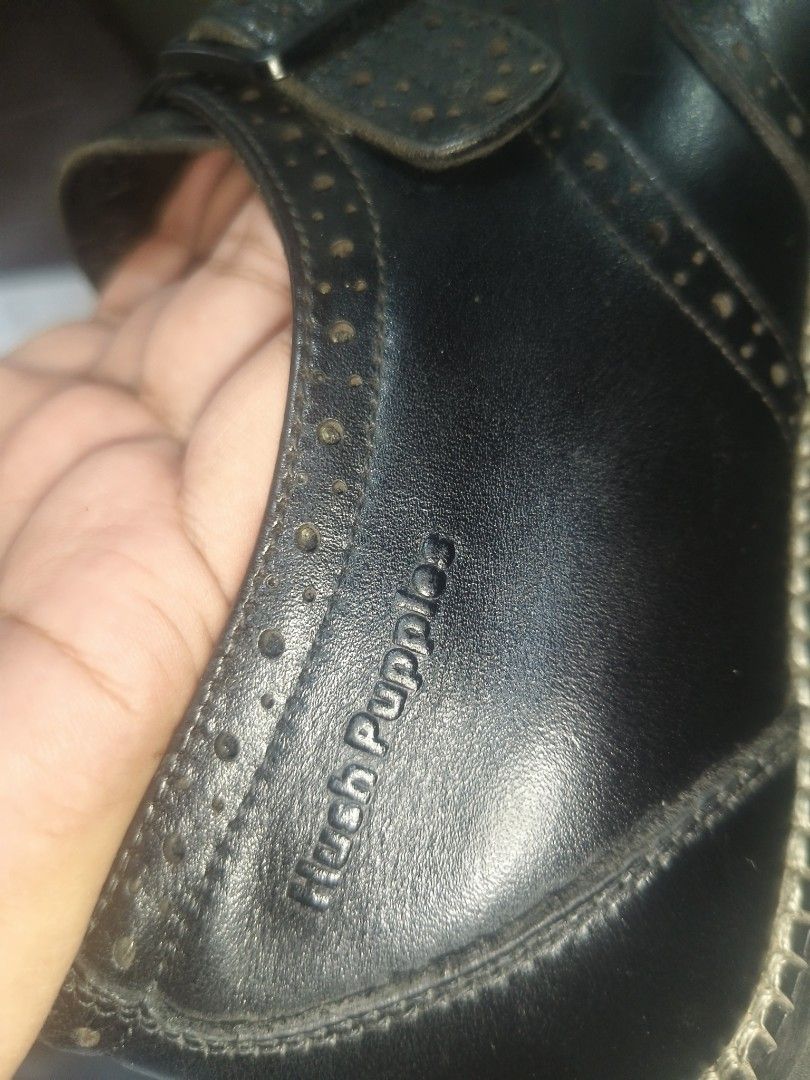 Hush Puppies Black Monk Strap Brogues (Category: Dress Shoes) located in Sariaya. Submitted by queen_1213 (Listing ID 1467257959, Image 2). Description: - Brand: Hush Puppies - Color/Material: Black leather - Style: Monk strap shoes with wingtip brogue detailing and single buckle closure - Comfort: DeepComfort blue insoles - Condition: Minor creasing from previous wear - Soles: Sturdy with good grip remaining.