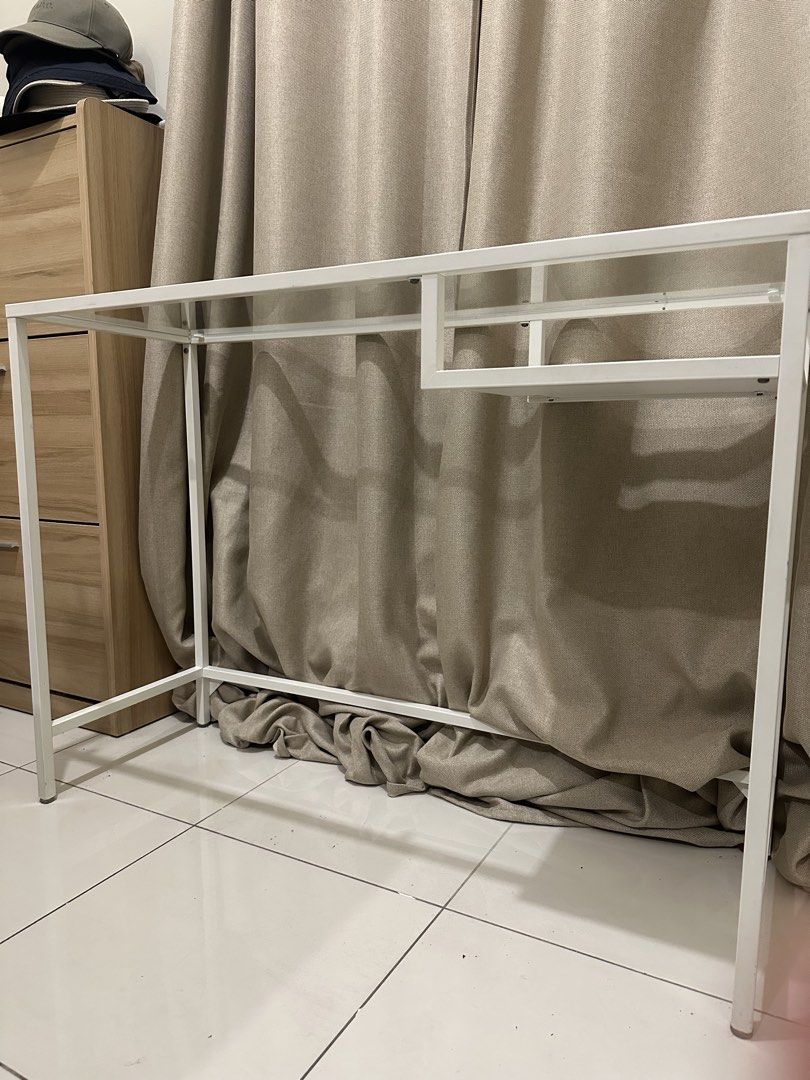 IKEA VITTSJÖ Laptop table (Category: Tables & Sets) located in Mandaluyong City. Submitted by ourcscloset (Listing ID 1463963895, Image 2). Description: white/glass, 100x36 cm (39 3/8x14 1/8 “) Glass is intact and table is well kept. No known issues. Would choose to keep it if we have the extra space since its minimalist and functional. No haggling, this is the last price. .