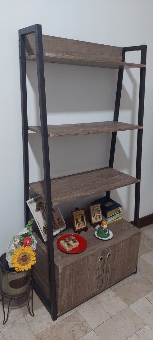 Industrial Wood Display Shelf (Category: Shelves, Cabinets & Racks) located in Manila. Submitted by mcangwong80885 (Listing ID 1467203389, Image 1). Description: - Style Industrial design with a wooden finish and black metal frame - Storage 4 open display shelves and a - Closed double-door cabinet - Condition: like new and sturdy build - Location: Ships within the Philippines / Meet-ups available upon request.