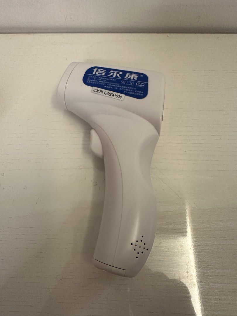 Infrared Body Thermometer (Category: Thermometers) located in Quezon City. Submitted by bqchane (Listing ID 1467262098, Image 3). Description: - Model: Berrcom JKB-17B Non-Contact Infrared Thermometer - Condition: Tested and fully working with minor handling marks - Display: Clear green backlit digital screen for easy reading - Features: Mode, sound, and memory control buttons - Design: Clean white body with a blue control panel - Power: Requires