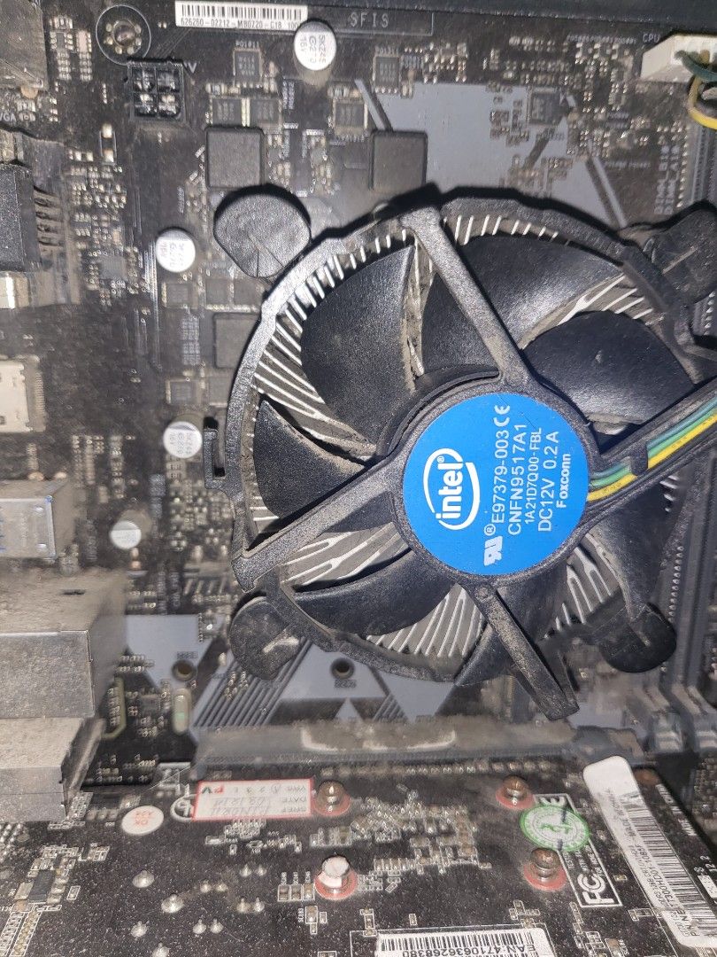 Intel Motherboard with CPU Cooler (Category: Desktops) located in Manila. Submitted by chipsahey (Listing ID 1467310999, Image 1). Description: Intel stock CPU cooler with Foxconn fan (DC12V 0.2A) mounted on motherboard. Needs cleaning due to dust. core i3 procie and hp motherboard with 500gb HDD and PSU all working..