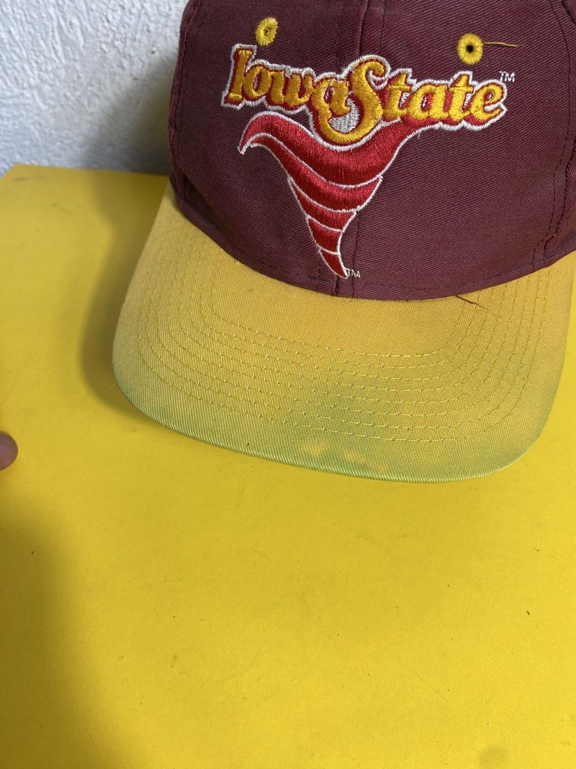 Iowa State Cyclones Vintage Snapback Cap (Category: Caps & Hats) located in Cabanatuan. Submitted by adrialesdrip (Listing ID 1467315763, Image 2). Description: - Team: Iowa State Cyclones - Color: Maroon and yellow - Design: Big embroidered tornado logo on front, 'CYCLONES' spelled out on the back - Closure: Yellow snap closure - Condition: Interior tag shows some fraying and wear, overall solid piece for fans.