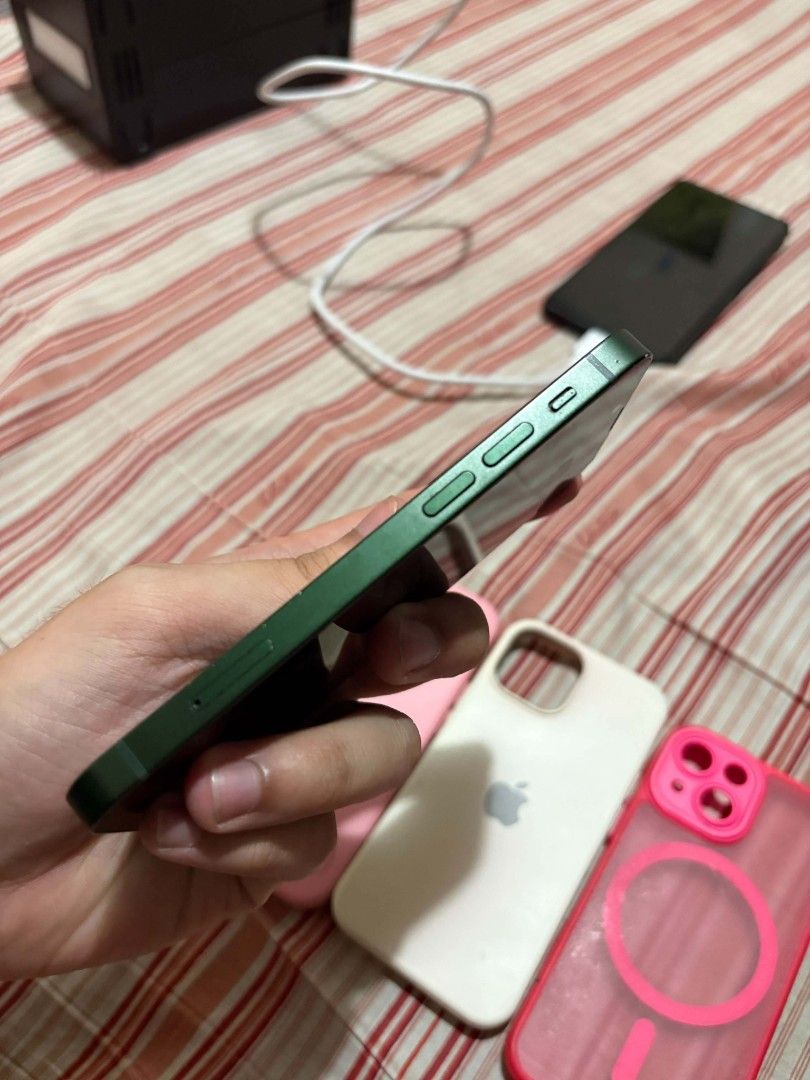 Ip 13 mini 128gb (Category: iPhone 13 Series) located in Manila. Submitted by ruscarps (Listing ID 1467310063, Image 2). Description: issues: dents, paint chips the rest all goods ✅ 95% BH ✅ no sim restricitions ✅ all orig parts ✅ all cam working ✅ true tone, face id working inclusion: cases, cord, orig box firm price dasma loc, can meet imus at salawag auto pass sa lowballers at BNS.