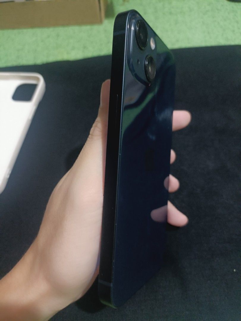 IPHONE 13 (Category: iPhone 13 Series) located in Caloocan City. Submitted by johnjerald52962 (Listing ID 1467237214, Image 3). Description: 🔥 FOR SALE: IPHONE 13 128GB 📱🌙 💙 Midnight Blue | ₱16,500 FIXED ✅ Local Variant ZP/A 🇵🇭 🔓 Openline | Face ID & True Tone working 🔋 100% Battery Health | 56 Cycle Count 🛡️ Warranty until February 2027 🎁 Free Baseus Charger, Case & Tempered Glass ⚠️ Minimal paint chips only (cosmetic issue). 💰 FIXED 