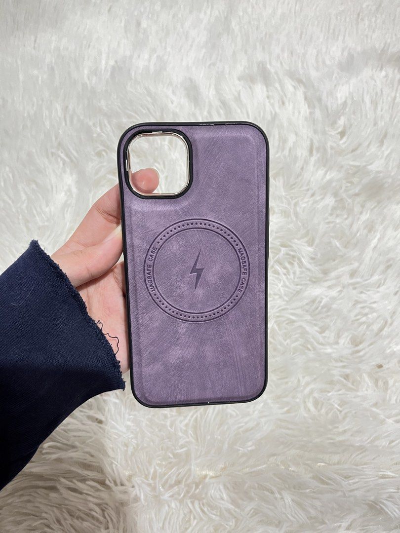 iPhone 13 Case (Category: Cases & Sleeves) located in Valenzuela. Submitted by lovepatt (Listing ID 1467232377, Image 2). Description: - Compatible Model: iPhone 13 - Available Designs: Purple MagSafe leather style, Orange with white camera bezel, Red translucent wavy pattern - Condition: Excellent, well-maintained - Features: Precise cutouts, stylish protection for daily use - Perfect for matching your OOTD or changing up your phone's look.