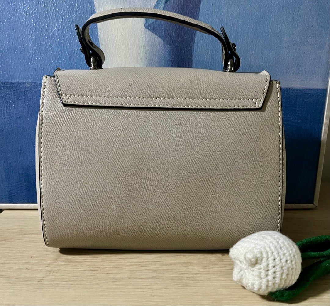 Italian Brand top handle bag (Category: Cross-body Bags) located in Quezon City. Submitted by madshoppe (Listing ID 1467258382, Image 2). Description: Like except for inside flap’s signs of use, not visible when closed see last 2 photos Very pretty taupe or apricot color and gunmetal hardwares With sling Small .