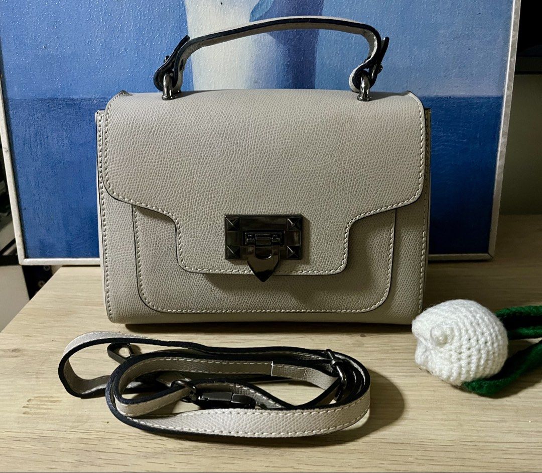 Italian Brand top handle bag (Category: Cross-body Bags) located in Quezon City. Submitted by madshoppe (Listing ID 1467258382, Image 3). Description: Like except for inside flap’s signs of use, not visible when closed see last 2 photos Very pretty taupe or apricot color and gunmetal hardwares With sling Small .