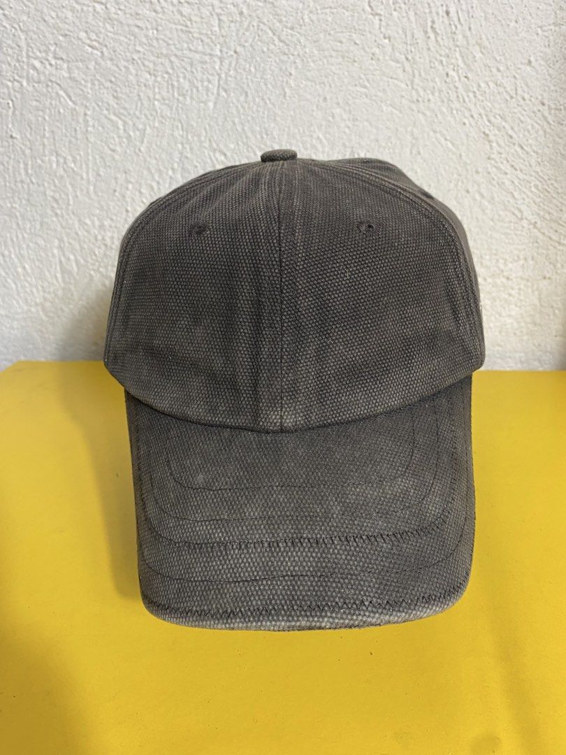Jacquemus Grey Canvas Baseball Cap (Category: Caps & Hats) located in Manila. Submitted by brightwater-2083 (Listing ID 1461732627, Image 2). Description: Grey canvas baseball cap from Jacquemus. Features the signature embroidered logo on the side. Adjustable strap at the back with a metal buckle. Made in China. Size 58..