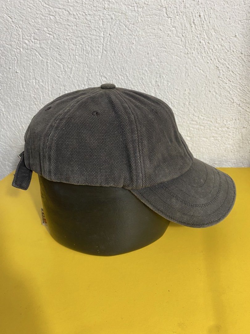 Jacquemus Grey Canvas Baseball Cap (Category: Caps & Hats) located in Manila. Submitted by brightwater-2083 (Listing ID 1461732627, Image 3). Description: Grey canvas baseball cap from Jacquemus. Features the signature embroidered logo on the side. Adjustable strap at the back with a metal buckle. Made in China. Size 58..
