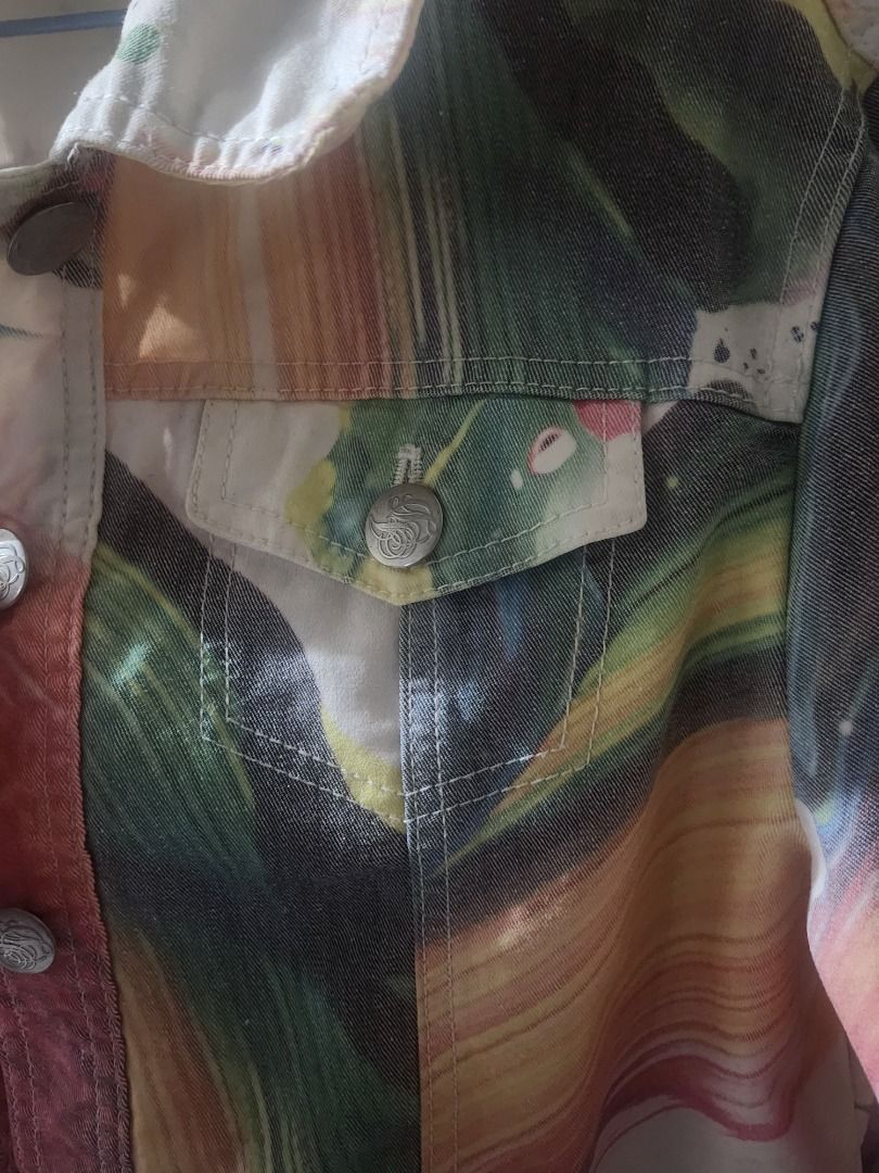 Jane Doe Abstract Paint Splatter Denim Jacket (Category: Coats, Jackets and Outerwear) located in Manila. Submitted by oshangdeep (Listing ID 1467279760, Image 2). Description: - Brand: Jane Doe - Style: Statement denim jacket with vibrant abstract paint splatters and brush strokes - Color: Multicolor - Features: Front button closures, dual chest pockets, and splatter details on the collar - Fit: Unstructured, lightweight, and great for layering 