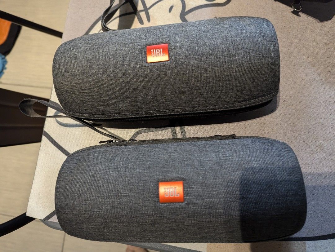 JBL Flip Carrying Case Portable Bluetooth Speaker Hard Shell (Category: Soundbars, Speakers & Amplifiers) located in Pasig City. Submitted by imperiumhk (Listing ID 1467179410, Image 1). Description: p 500 each ... Grey hard carrying case for JBL portable speakers. Fits Flip charge 3 models. Textured fabric exterior with bright orange JBL logo patch. Sturdy zipper closure all around. Attached loop handle on top for easy carrying. Soft fabric lini