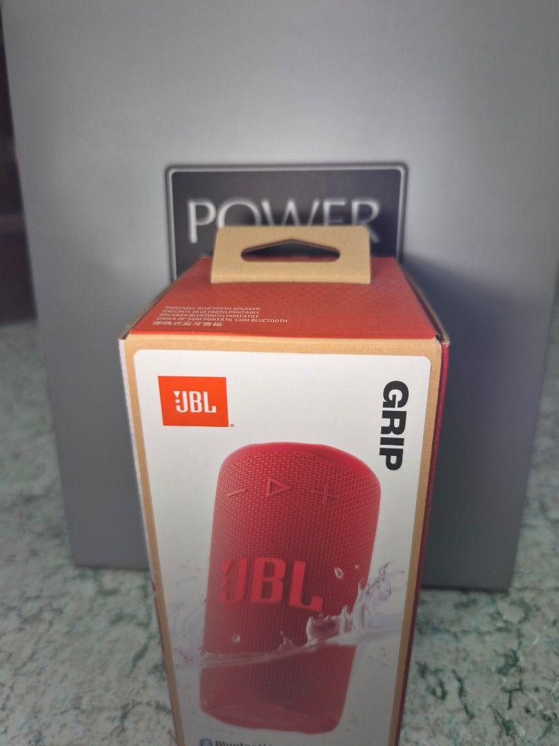 JBL Grip Portable Bluetooth Speaker Red (Category: Soundbars, Speakers & Amplifiers) located in Quezon City. Submitted by the.greys.shop (Listing ID 1467206730, Image 1). Description: - Item: Sealed JBL Grip Portable Bluetooth Speaker - Color: Vibrant Red - Condition: Brand new, never opened or used - Packaging: Original box with barcode sticker with and price tag still attached - Features: Wireless audio playback on the go with Power Mac Center 