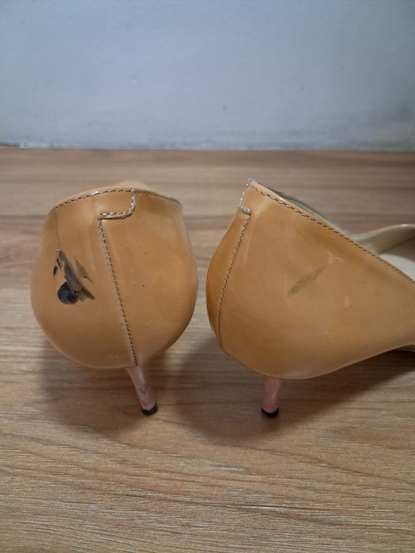 Jimmy Choo pumps (Category: Sneakers & Footwear) located in Muntinlupa City. Submitted by msshoppingera (Listing ID 1467220243, Image 3). Description: Jimmy Choo genuine patent leather pumps. Colour nude. Black ink stain at the back of the left shoe. Size 38 1/2 All items are available unless marked as sold. Payment first before shipping. Shipping fees will be shouldered by the buyer. No return No exchange.
