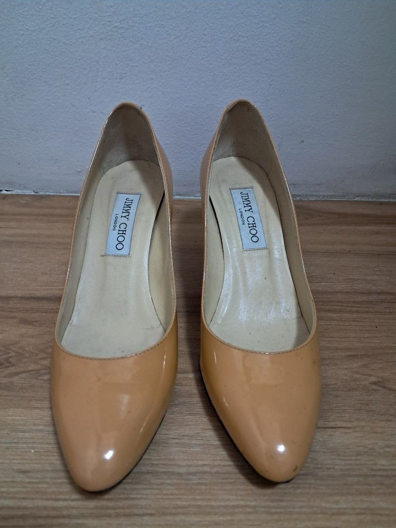 Jimmy Choo pumps (Category: Sneakers & Footwear) located in Muntinlupa City. Submitted by msshoppingera (Listing ID 1467220243, Image 1). Description: Jimmy Choo genuine patent leather pumps. Colour nude. Black ink stain at the back of the left shoe. Size 38 1/2 All items are available unless marked as sold. Payment first before shipping. Shipping fees will be shouldered by the buyer. No return No exchange.
