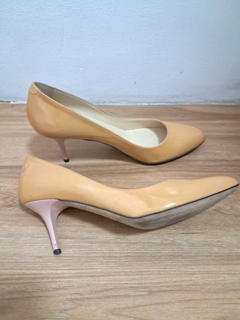Jimmy Choo pumps (Category: Sneakers & Footwear) located in Muntinlupa City. Submitted by msshoppingera (Listing ID 1467220243, Image 2). Description: Jimmy Choo genuine patent leather pumps. Colour nude. Black ink stain at the back of the left shoe. Size 38 1/2 All items are available unless marked as sold. Payment first before shipping. Shipping fees will be shouldered by the buyer. No return No exchange.