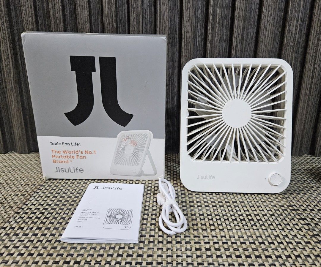 Jisulife Table Fan Life1 FA26 (Category: Fans) located in Rizal. Submitted by cherry_garcia (Listing ID 1467242827, Image 1). Description: - Model: Jisulife Life1 FA26 Table Fan - Color: White - Size: Approx. 7" tall x 5" wide (compact & portable) - Features: Foldable stand, USB rechargeable - Inclusions: Original box, charging cable, and user manual - Condition: Excellent, great for desks and bedside tables.
