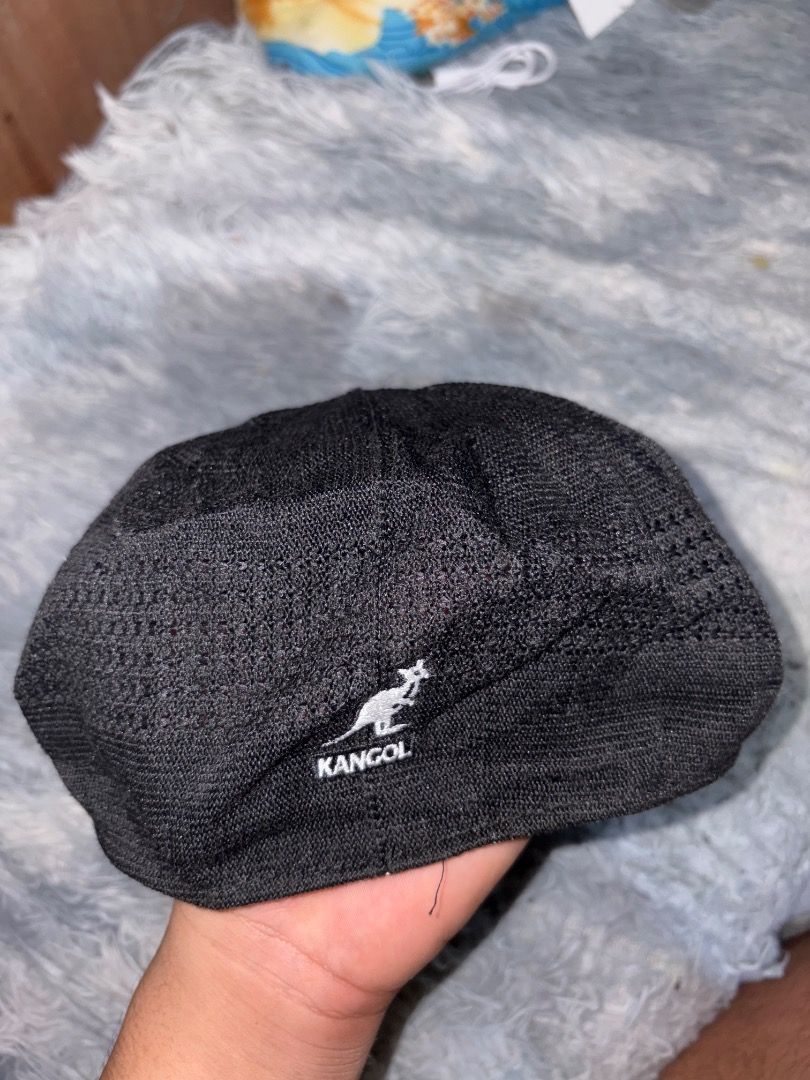 Kangol Black Flat Cap (Category: Caps & Hats) located in Danao, Cebu. Submitted by kentoy25 (Listing ID 1467328928, Image 2). Description: - Authentic Kangol black flat cap - Classic woven texture with lightweight structured fit - Signature white kangaroo logo embroidered on the side - Versatile piece, perfect for streetwear and casual outfits - Well-maintained and ready to wear.