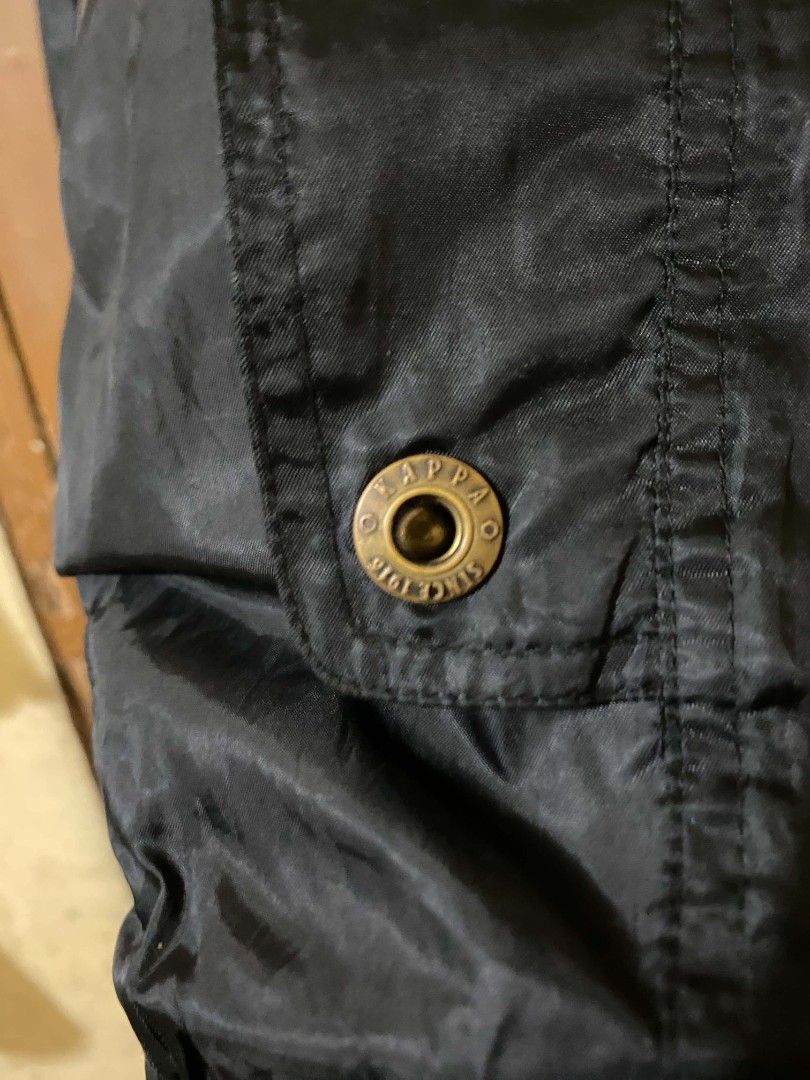Kappa Black Zip-Up Jacket with 3M Scotchlite Reflective (Category: Coats, Jackets and Outerwear) located in Taguig. Submitted by cabugchear34421 (Listing ID 1467200023, Image 3). Description: - Kappa - Full zip closure with mock neck and iconic embroidered chest logo - 3M Scotchlite reflective tape piping along sleeves and shoulders - Multiple front pockets with secure zipper and snap button closures - Ribbed hem and cuffs for a snug and secure f