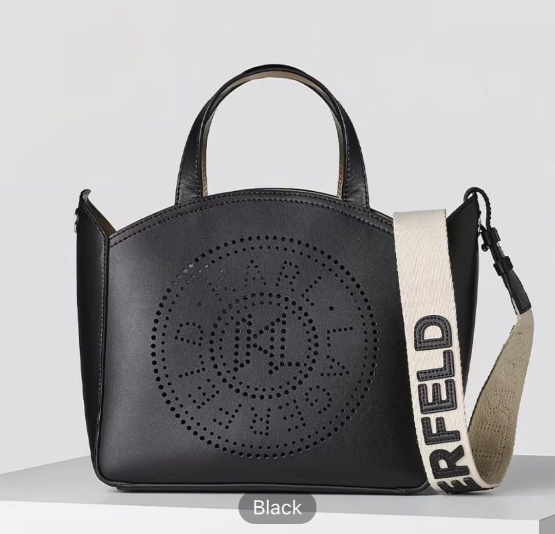 Karl Lagerfeld Perforated Logo Tote Bag (Category: Tote Bags) located in Pasay City. Submitted by kgemsluxuryboutique (Listing ID 1467332642, Image 1). Description: - Brand: Karl Lagerfeld - Design: Cut-out circular logo on front with a structured silhouette - Colors Available: Black and Brown - Carry Options: Two top handles and a wide canvas shoulder strap with bold lettering - Closure: Open top design - Capacity: Spacious interior, perfect for