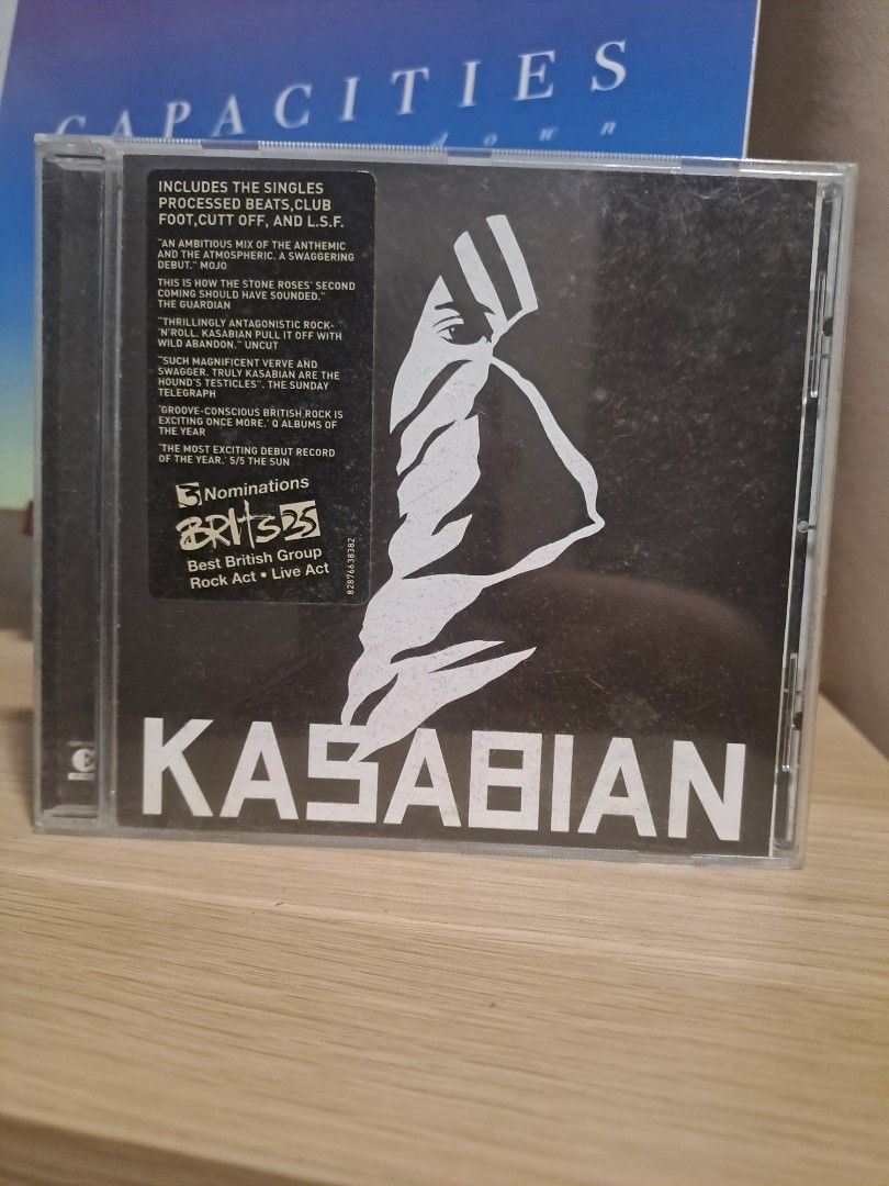 Kasabian Self Titled Album CD (Category: CDs & DVDs) located in Las Pinas. Submitted by cobieshop (Listing ID 1467319343, Image 1). Description: - Artist: Kasabian - Format: Audio CD (Standard jewel case) - Hit Singles: Processed Beats, Club Foot, Cutt Off, L.S.F. - Condition: Brand new/Mint (includes original hype sticker mentioning Brit Awards nominations) - Features: Includes track listing and critical review quotes on the sticker.