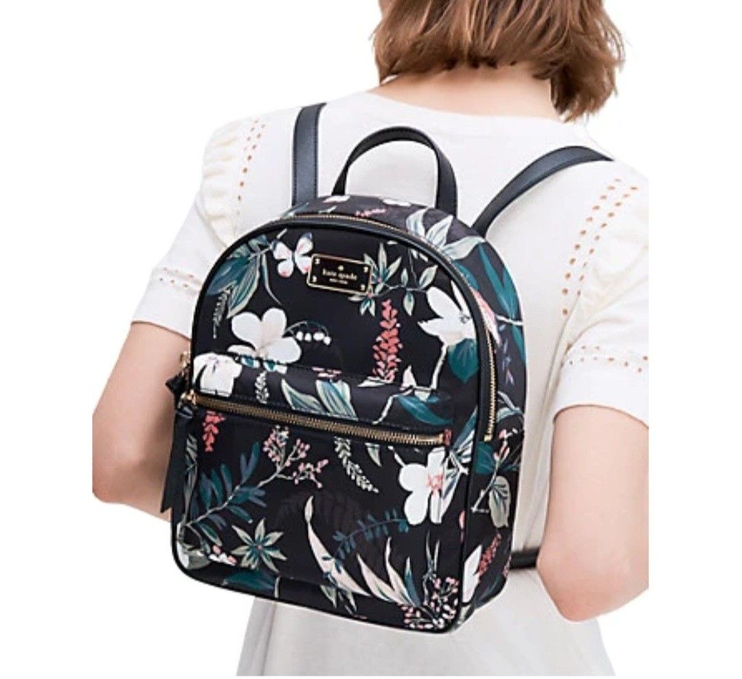 Kate Spade Wilson Road Botanical Small Bradley Backpack (Category: Backpacks) located in Santa Rosa. Submitted by alfonsocadiz (Listing ID 1467175406, Image 1). Description: - Brand: Kate Spade - Design: Black floral pattern with butterflies and gold hardware - Straps & Handle: Top handle and adjustable shoulder straps - Pockets: Front zippered pocket, plus interior zip and slip pockets - Lining: Signature spade interior lining - Condition: Clean