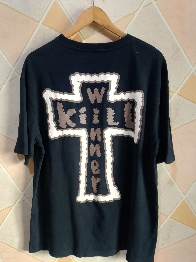 Kill Winner Black Graphic T-Shirt XL (Category: Tshirts & Polo Shirts ) located in San Pedro. Submitted by jokwanrocks09 (Listing ID 1467247021, Image 1). Description: Kill Winner black graphic tee in size XL. Small logo print on the front chest. Large cross graphic with text across the back. Heavy cotton material, relaxed boxy fit. Blue inner neck tag with brand name and sizing. Clean condition, no fading or cracking on the prints. 23x30 boxy ov