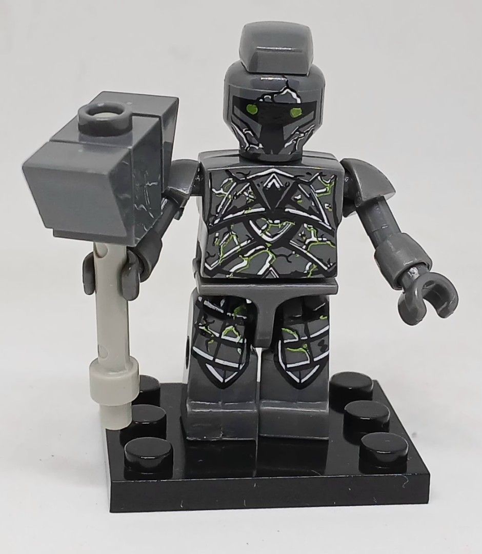 Kre-O Dungeons and Dragons STATUE Warrior minifigure (Category: Lego & Building Sets) located in Manila. Submitted by brunobeaut55620 (Listing ID 1467212738, Image 1). Description: - Kre-O Dungeons and Dragons STATUE Warrior Army Builder Pack Collection 1 minifigure with striking green glowing details on torso, legs, and helmet - Comes with a matching dark grey custom buildable hammer accessory - Mounted securely on a standard black 2x4 display p