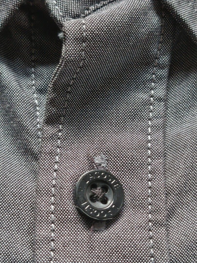 Lacost Live Button Down (Category: Tshirts & Polo Shirts ) located in Taguig. Submitted by _theroom.ph (Listing ID 1467198968, Image 3). Description: - Brand: Lacoste Live - Style: Short sleeve button-down shirt with collar - Color: Gray - Size: 39 (165/84A) - Material: 100% cotton - Details: Branded dark buttons and embroidered crocodile logo on chest - Condition: Clean inside and out, excellent pre-owned condition - Origin: Designed in France L