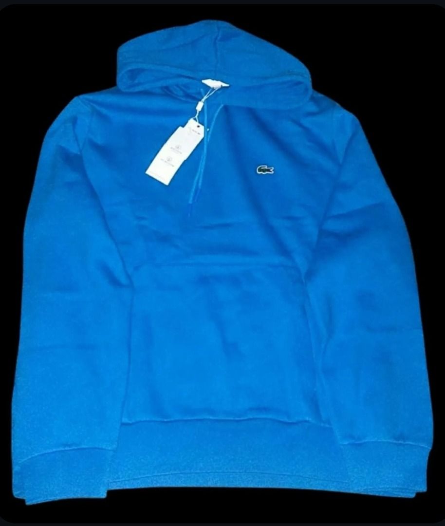 Lacoste Blue Hooded Sweatshirt with Tags (Category: Coats, Jackets and Outerwear) located in Caloocan City. Submitted by quickrabbit_19d882 (Listing ID 1467267152, Image 1). Description: - Brand: Lacoste - Color: Bright blue - Condition: Brand new with original store tags still attached - Features: Classic embroidered crocodile logo, matching drawstrings, front kangaroo pocket, ribbed cuffs and hem - Material: Soft and comfortable cotton blend.