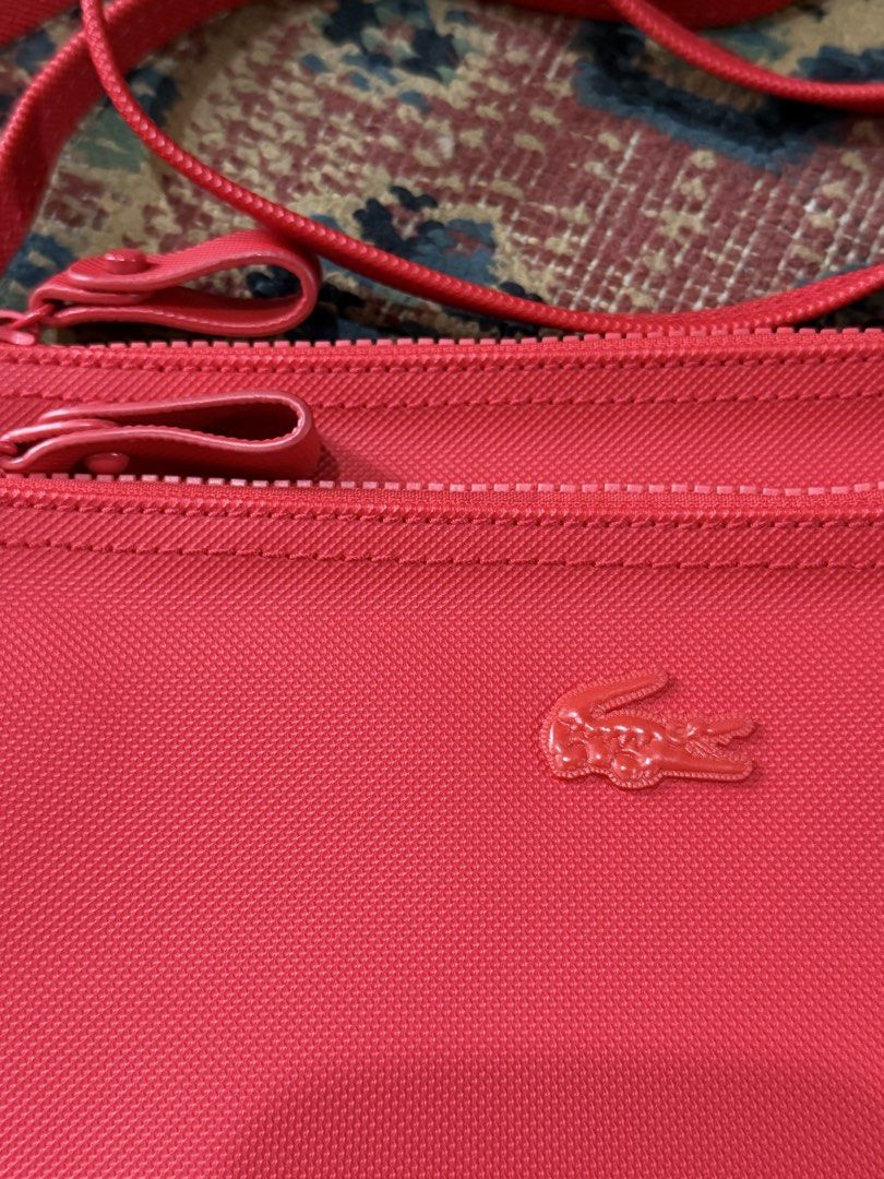 Lacoste Double-zip Flat Sling Bag (Category: Cross-body Bags) located in Makati City. Submitted by refind.prelove.finds (Listing ID 1467185011, Image 2). Description: Authentic Used once .