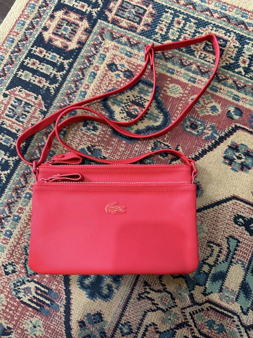 Lacoste Double-zip Flat Sling Bag (Category: Cross-body Bags) located in Makati City. Submitted by refind.prelove.finds (Listing ID 1467185011, Image 1). Description: Authentic Used once .