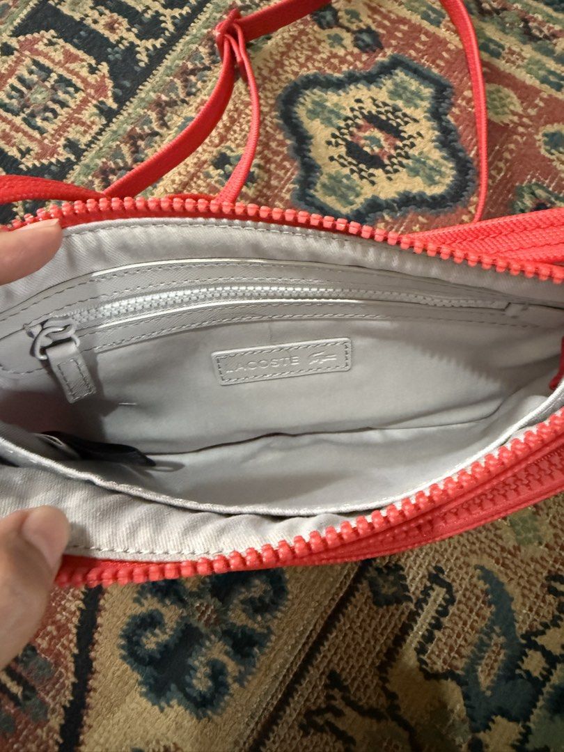 Lacoste Double-zip Flat Sling Bag (Category: Cross-body Bags) located in Makati City. Submitted by refind.prelove.finds (Listing ID 1467185011, Image 3). Description: Authentic Used once .