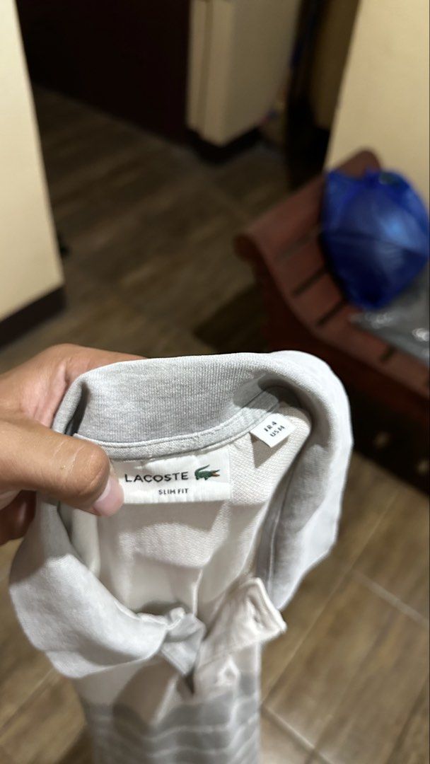 LACOSTE GREY STRIPE (Category: Tshirts & Polo Shirts ) located in Manila. Submitted by urban-vintage_2 (Listing ID 1467220630, Image 3). Description: ISSUE: PINHOLE ( NEED WASH ) MOP :GCASH ( NO COD ) SHIP VIA : LALAMOVE & J&T LOCATION : PASIG CITY LENGTH : 30 WIDTH : 19 .