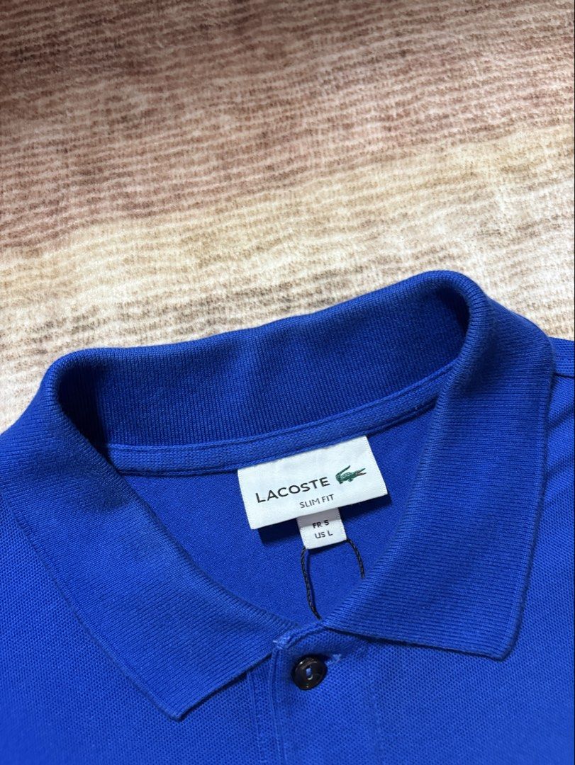 Lacoste Slimfit Blue Poloshirt (Category: Tshirts & Polo Shirts ) located in Antipolo. Submitted by thearchivesproject (Listing ID 1467320311, Image 3). Description: Like New 19 width 27.5 length.