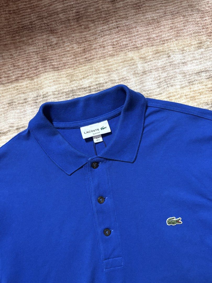 Lacoste Slimfit Blue Poloshirt (Category: Tshirts & Polo Shirts ) located in Antipolo. Submitted by thearchivesproject (Listing ID 1467320311, Image 2). Description: Like New 19 width 27.5 length.
