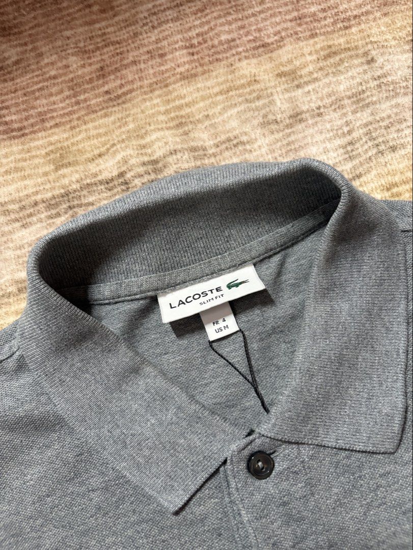 Lacoste Slimfit Gray Poloshirt (Category: Tshirts & Polo Shirts ) located in Antipolo. Submitted by thearchivesproject (Listing ID 1467318986, Image 3). Description: 20 width 27 length.