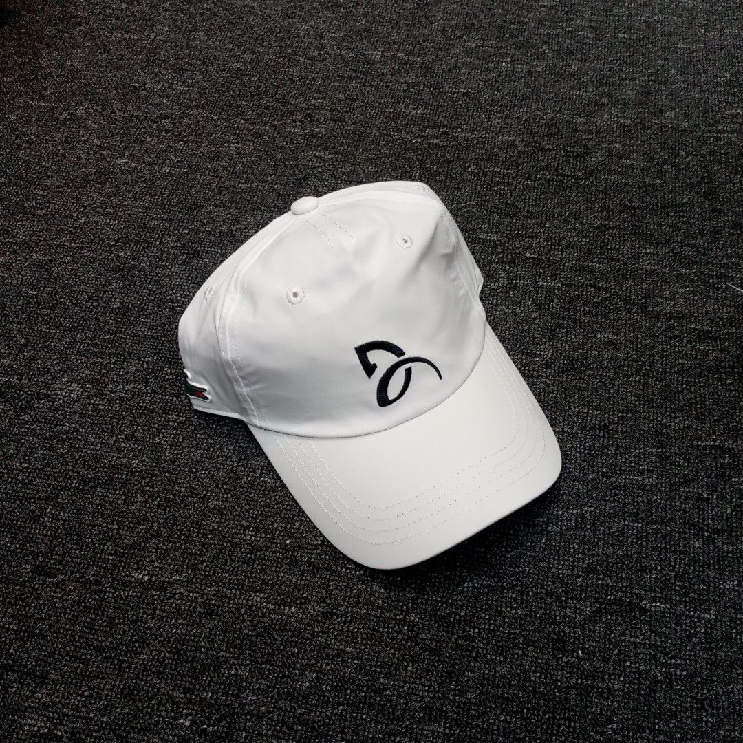 Lacoste Sport White Baseball Cap (Category: Caps & Hats) located in Manila. Submitted by pablopresk0. (Listing ID 1467313919, Image 1). Description: - Brand: Lacoste Sport - Color: Clean White - Design: Embroidered tennis logo on the front with the classic green crocodile patch on the side - Fit: Adjustable strap with metal buckle at the back - Condition: Ready to wear with internal branding tags intact Manila location📍 Pm if interested📩.
