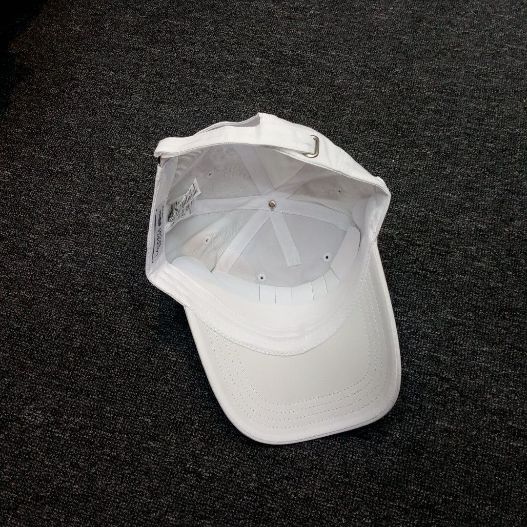 Lacoste Sport White Baseball Cap (Category: Caps & Hats) located in Manila. Submitted by pablopresk0. (Listing ID 1467313919, Image 3). Description: - Brand: Lacoste Sport - Color: Clean White - Design: Embroidered tennis logo on the front with the classic green crocodile patch on the side - Fit: Adjustable strap with metal buckle at the back - Condition: Ready to wear with internal branding tags intact Manila location📍 Pm if interested📩.