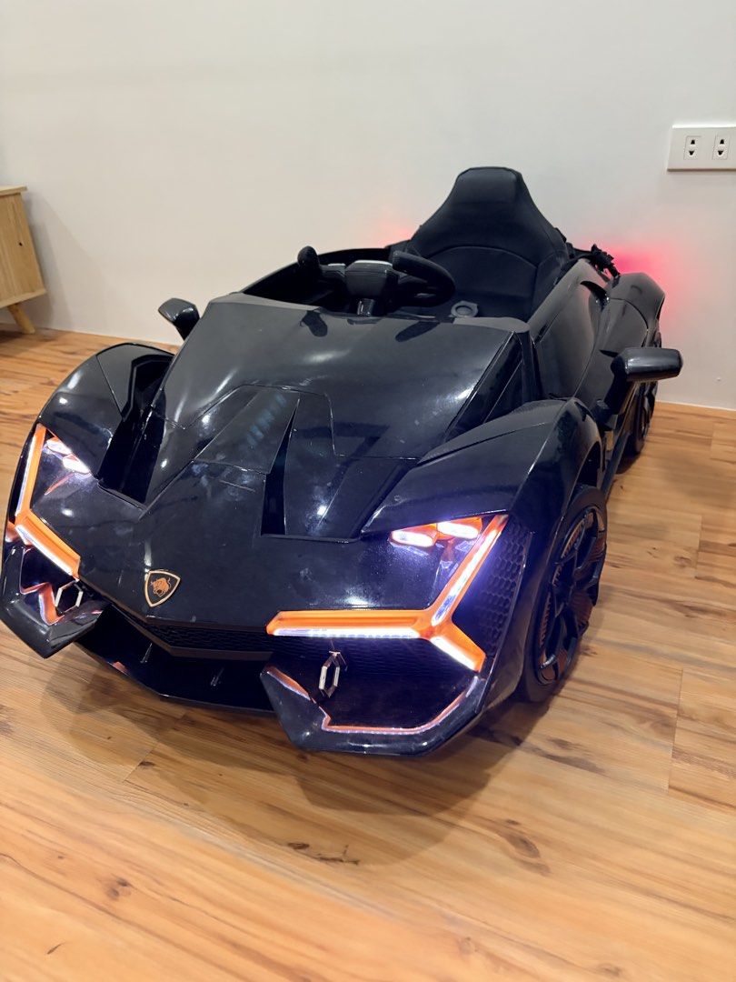 Lamborghini Ride on Remote Control (Category: Remote Control Toys) located in Las Pinas. Submitted by carou56713 (Listing ID 1467350451, Image 2). Description: Lamborghini Ride On Remote Control (Little riders PH) No issue -opening doors -seat with safety belt -remote control and charger included -detailed headlights and tailights -stylish wheel design Bought Feb 2026 for my son’s 1st birthday. There are minimal signs of usage which is hindi masy
