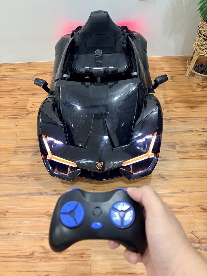 Lamborghini Ride on Remote Control (Category: Remote Control Toys) located in Las Pinas. Submitted by carou56713 (Listing ID 1467350451, Image 1). Description: Lamborghini Ride On Remote Control (Little riders PH) No issue -opening doors -seat with safety belt -remote control and charger included -detailed headlights and tailights -stylish wheel design Bought Feb 2026 for my son’s 1st birthday. There are minimal signs of usage which is hindi masy